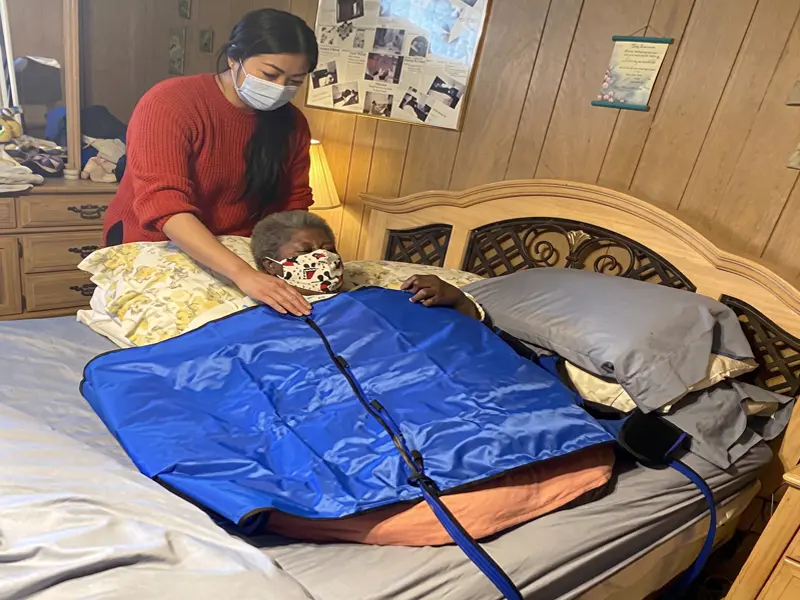 Healthcare professional providing compression therapy patient support